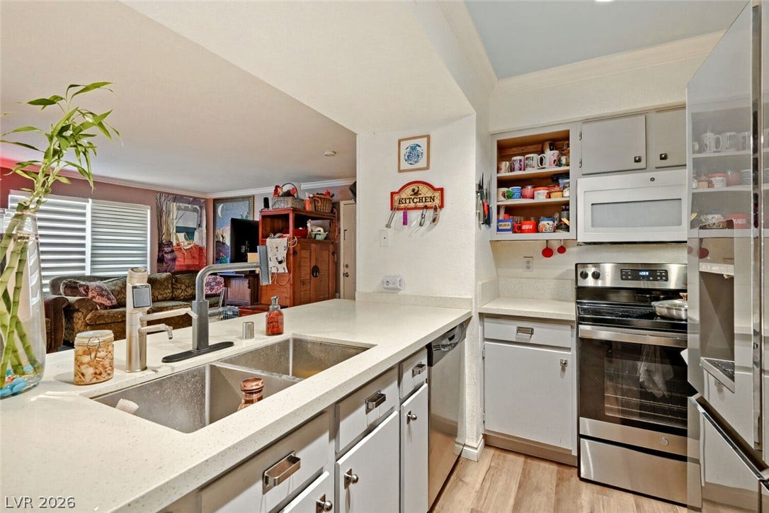 8101 W Flamingo Road, #1074, Las Vegas, NV 89147 An open floor plan connects this kitchen to the adjacent living area.