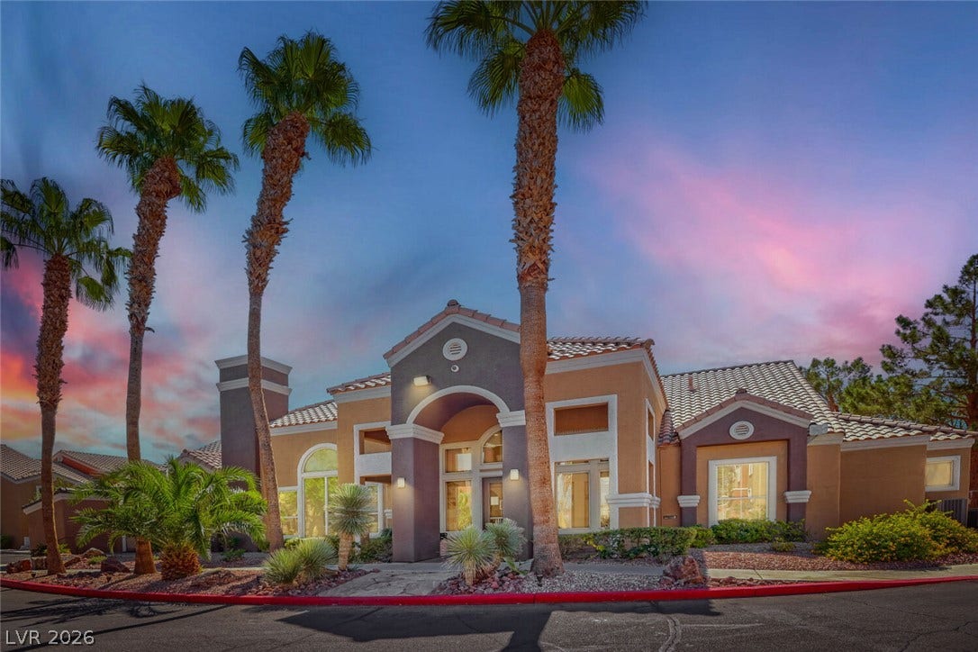 8101 W Flamingo Road, #1074, Las Vegas, NV 89147 Towering palm trees frame the grand tiled entry of this single-level desert stucco home.