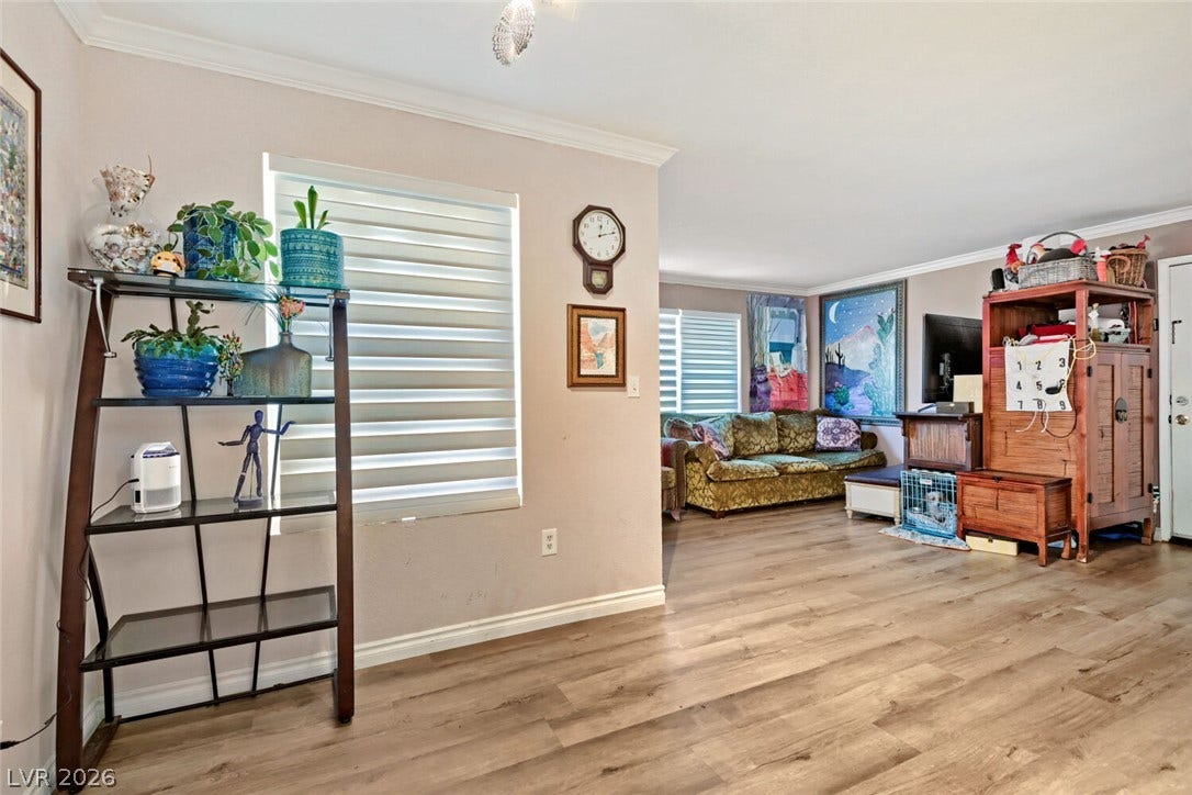 8101 W Flamingo Road, #1074, Las Vegas, NV 89147 Gleaming wood-look floors sweep through this open and airy living space.