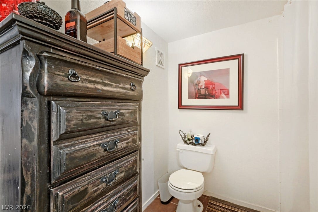 8101 W Flamingo Road, #1074, Las Vegas, NV 89147 A compact restroom includes practical tiled flooring alongside smooth white walls.