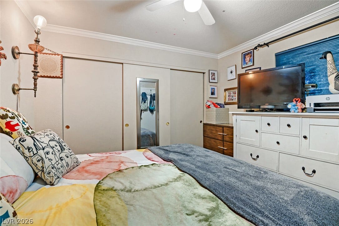 8101 W Flamingo Road, #1074, Las Vegas, NV 89147 Plentiful closet space and classic crown molding accent this comfortable private bedroom.