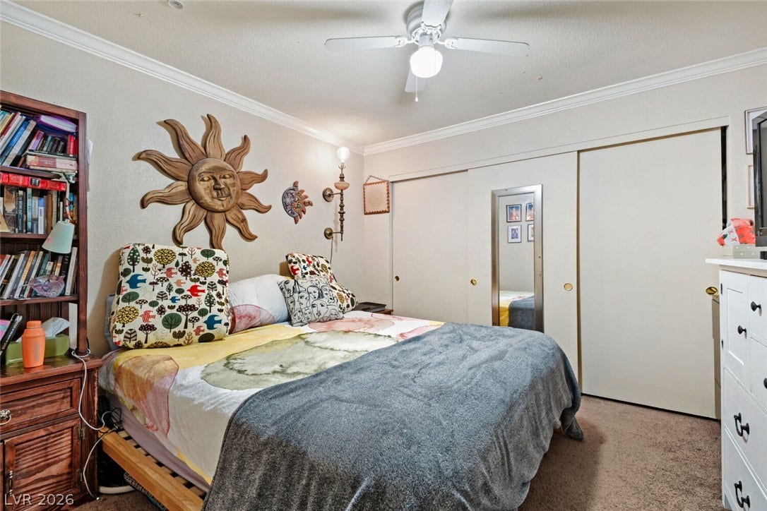 8101 W Flamingo Road, #1074, Las Vegas, NV 89147 Plush carpeting and elegant crown molding define this comfortable sleeping space.