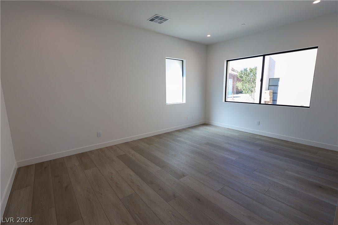 Clean lines and light wood flooring define this versatile, minimalist interior space.
