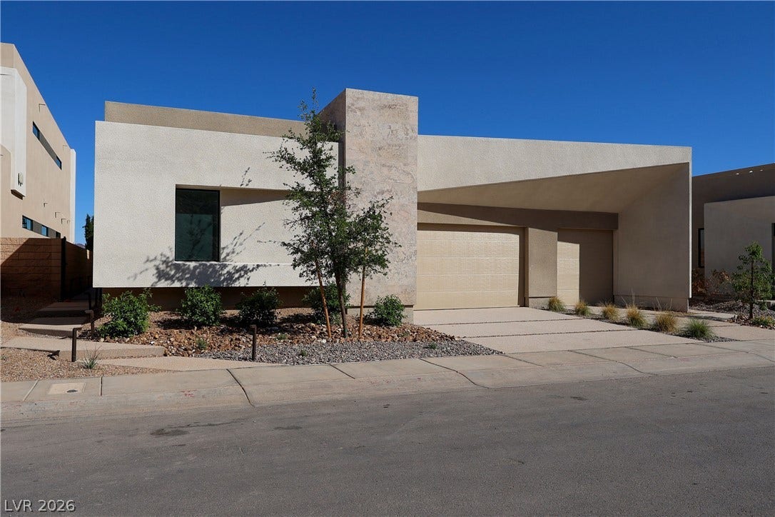 Striking contemporary architecture defines this modern desert home with clean geometric lines.