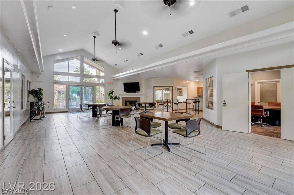 Gleaming tile floors and vaulted ceilings elevate this open interior space.