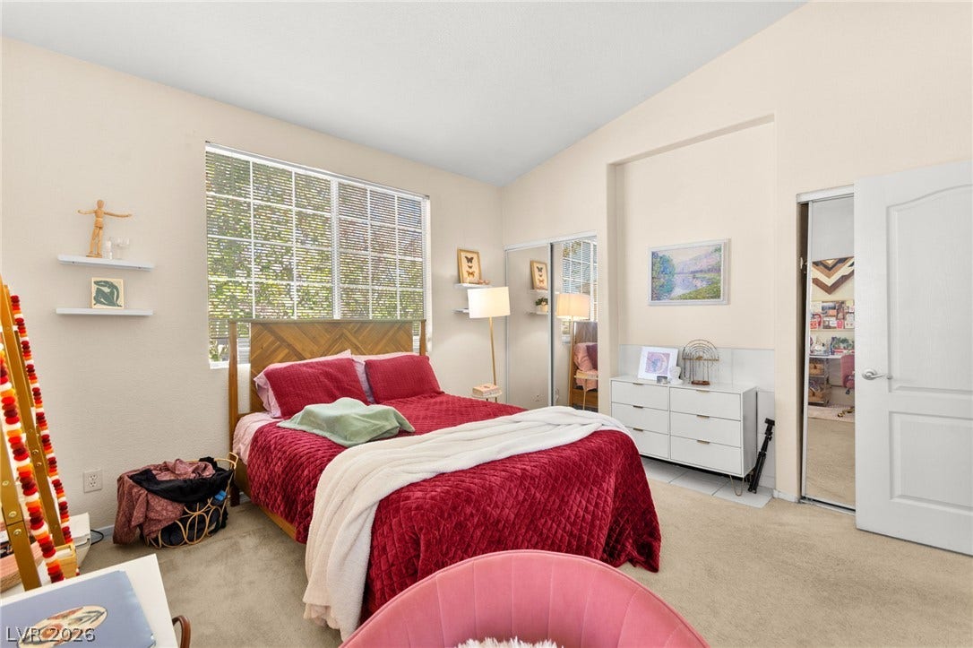 7628 Pacific Hills Avenue, #204, Las Vegas, NV 89128 High ceilings and tall windows enhance the architectural sense of space in this bedroom.