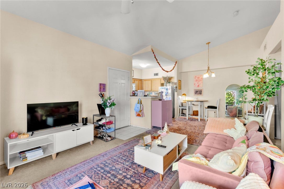 7628 Pacific Hills Avenue, #204, Las Vegas, NV 89128 An open floorplan connects the comfortable living area directly to the kitchen.