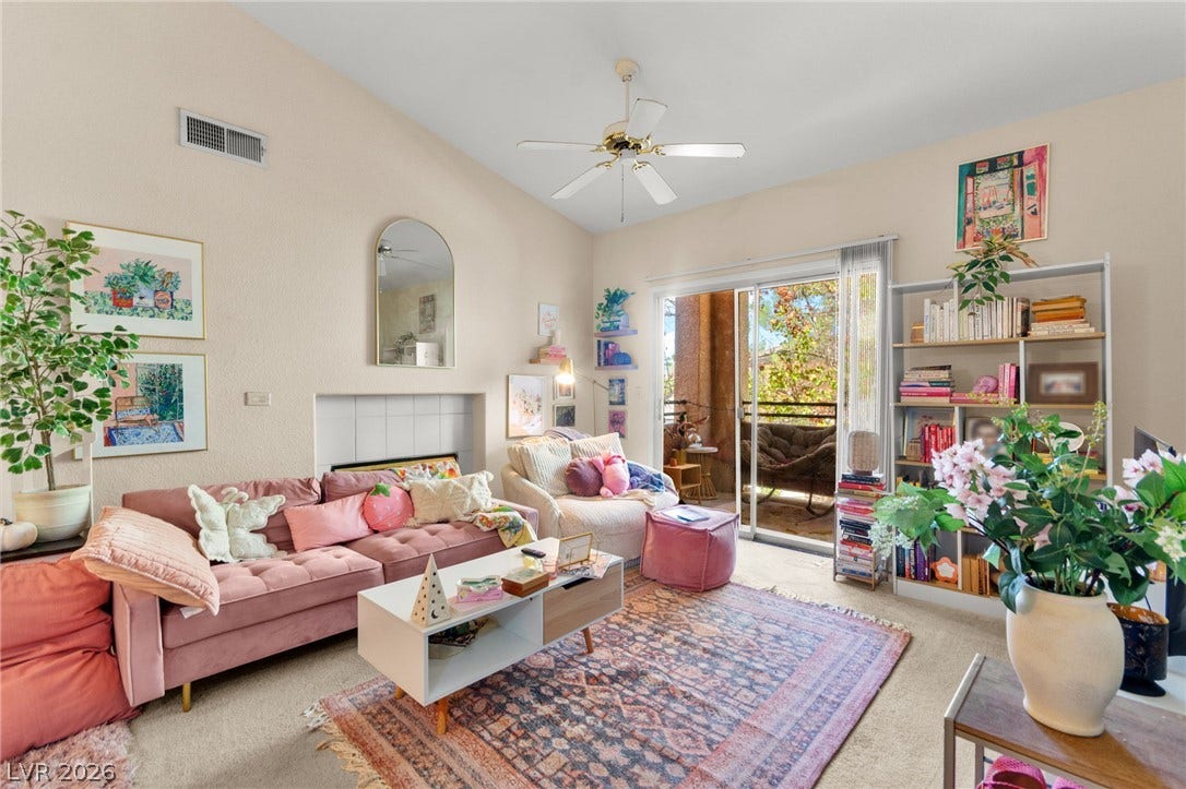 7628 Pacific Hills Avenue, #204, Las Vegas, NV 89128 Vaulted ceilings and sliding glass doors create an open atmosphere filled with natural light.