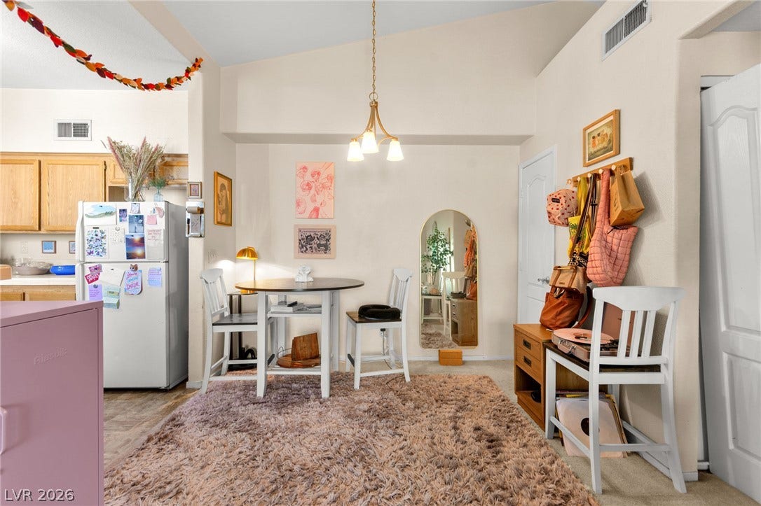 7628 Pacific Hills Avenue, #204, Las Vegas, NV 89128 Vaulted ceilings soar over a versatile dining area adjacent to the kitchen.