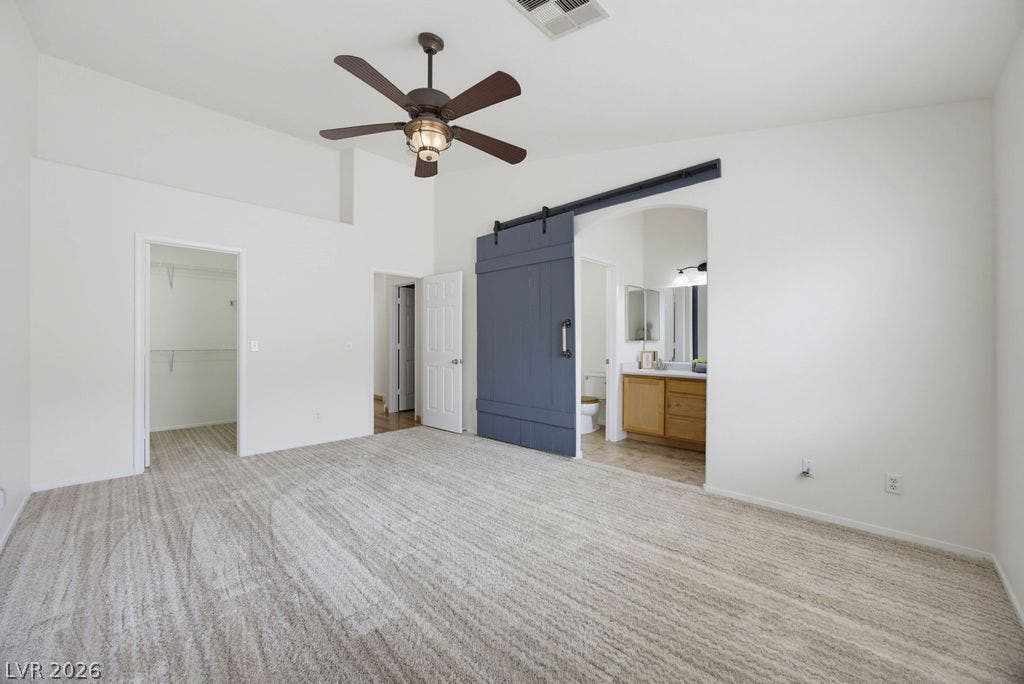 409 Groft Way, Henderson, NV 89015 High ceilings and brand new plush carpeting define this spacious bedroom leading directly to the ensuite bath.