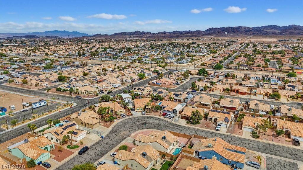 409 Groft Way, Henderson, NV 89015 Distant mountains frame a sprawling suburban neighborhood connected by quiet residential streets.