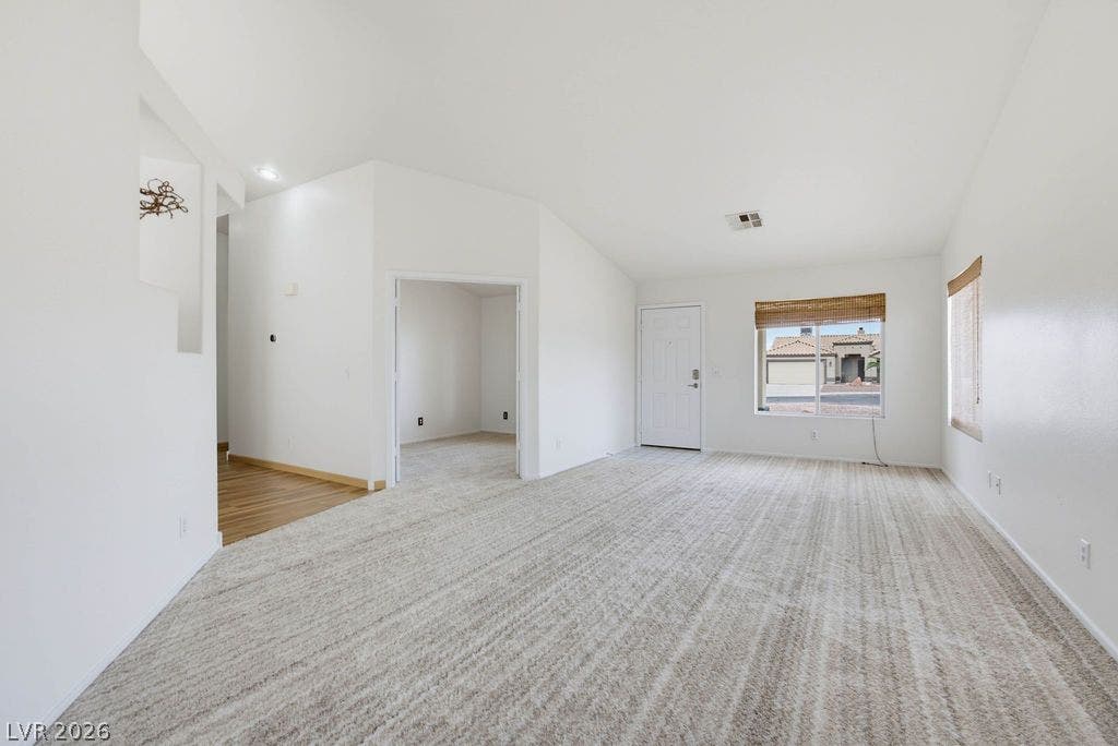 409 Groft Way, Henderson, NV 89015 Vaulted ceilings and textured carpeting define this versatile living space.