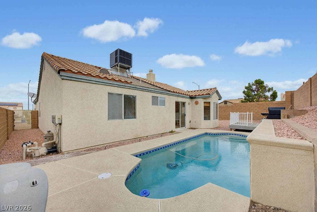 409 Groft Way, Henderson, NV 89015 An inviting in-ground swimming pool defines this private backyard retreat surrounded by masonry walls.
