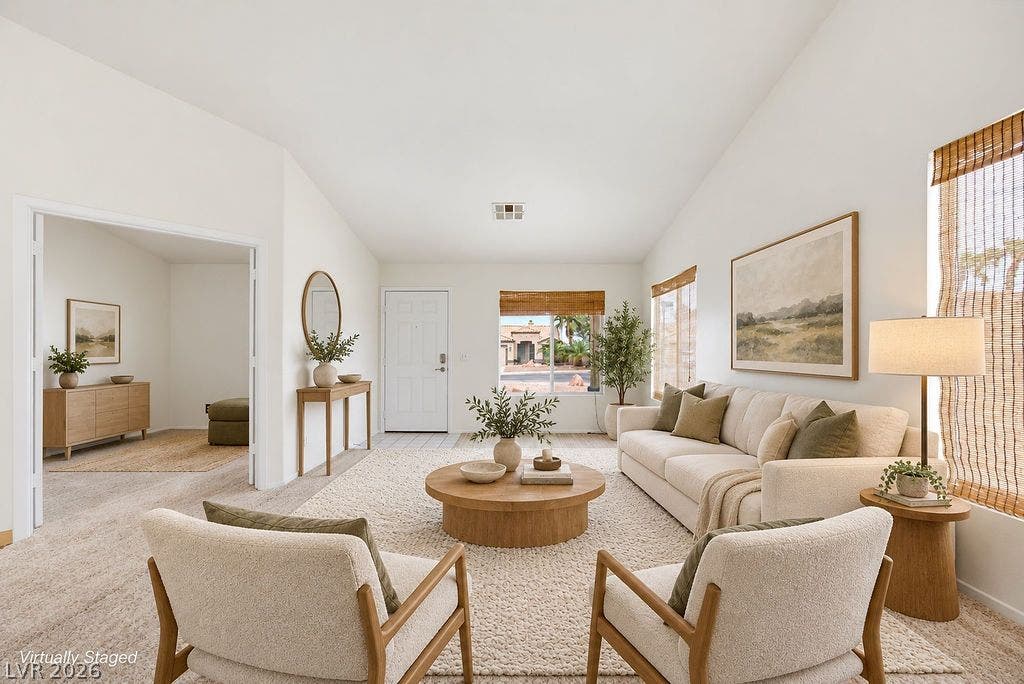 409 Groft Way, Henderson, NV 89015 VIRTUALLY STAGED - High vaulted ceilings and comfortable carpeting define this airy living room.