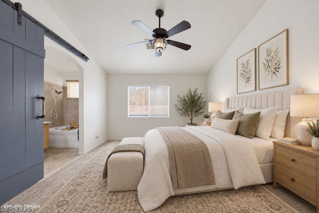 409 Groft Way, Henderson, NV 89015 VIRTUALLY STAGED - High vaulted ceilings and a sliding barn door elevate this spacious master suite.