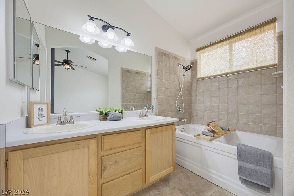 409 Groft Way, Henderson, NV 89015 Double vanities and a deep soaking tub create a comfortable personal retreat.