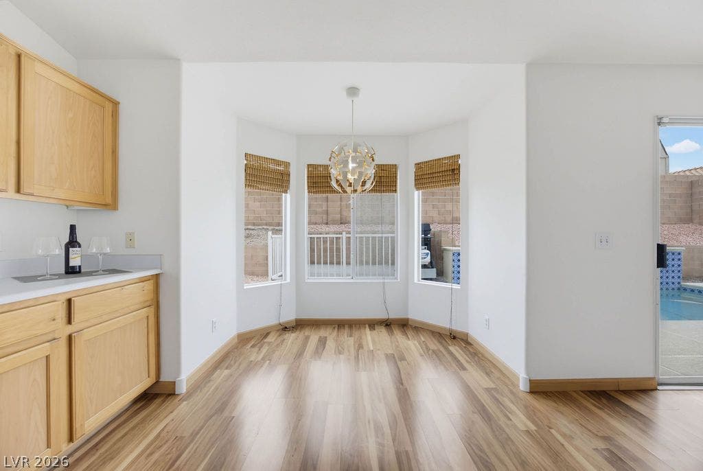 409 Groft Way, Henderson, NV 89015 Gleaming hardwood floors and a bright bay window enhance this versatile breakfast area.