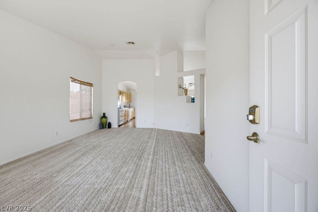 409 Groft Way, Henderson, NV 89015 An open entryway flows directly into a spacious living area with soft textured carpeting.