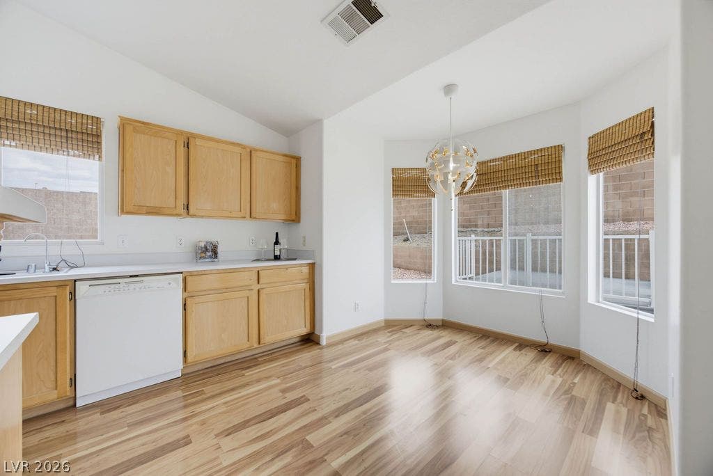 409 Groft Way, Henderson, NV 89015 Natural light pours over wood flooring and classic cabinetry in this casual dining space.