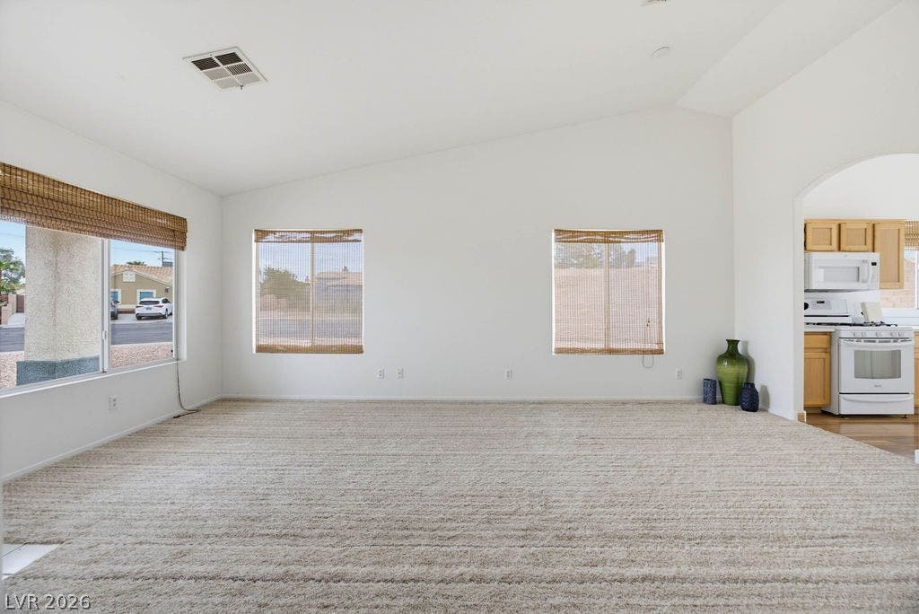 409 Groft Way, Henderson, NV 89015 Vaulted ceilings and textured carpeting create a comfortable living space near the kitchen.