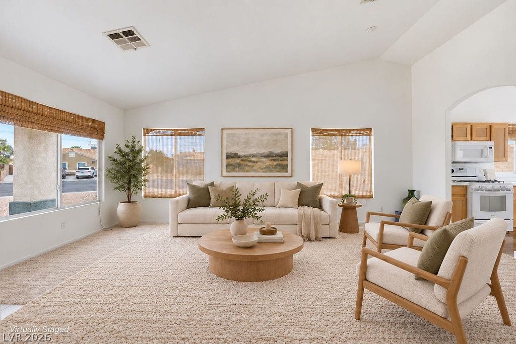 409 Groft Way, Henderson, NV 89015 VIRTUALLY STAGED - Vaulted ceilings and large windows create an airy atmosphere throughout this inviting living space.