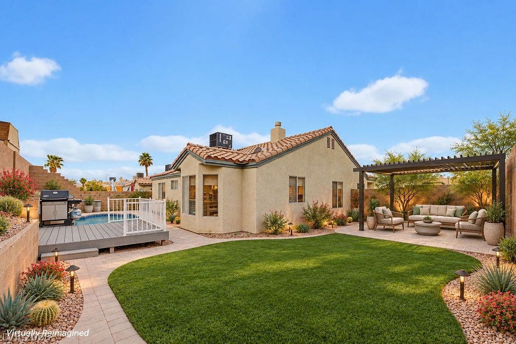 409 Groft Way, Henderson, NV 89015 VIRTUALLY STAGED to show the design option with synthetic lawn area and paved pathways frame this private backyard retreat featuring a classic tile roof.