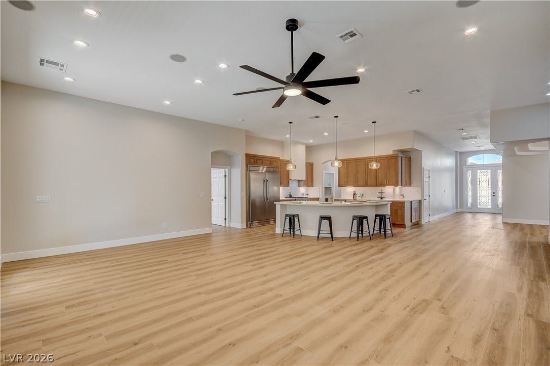 An airy open layout connects the spacious living area to a well-equipped kitchen.