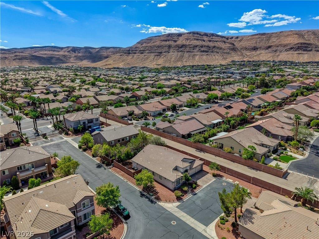 Dramatic mountain vistas rise above this quiet residential neighborhood.