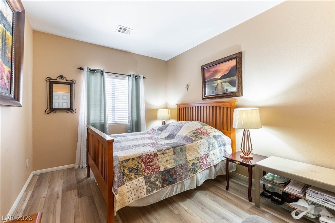Smooth wood flooring and a classic window frame this comfortable, quiet retreat.