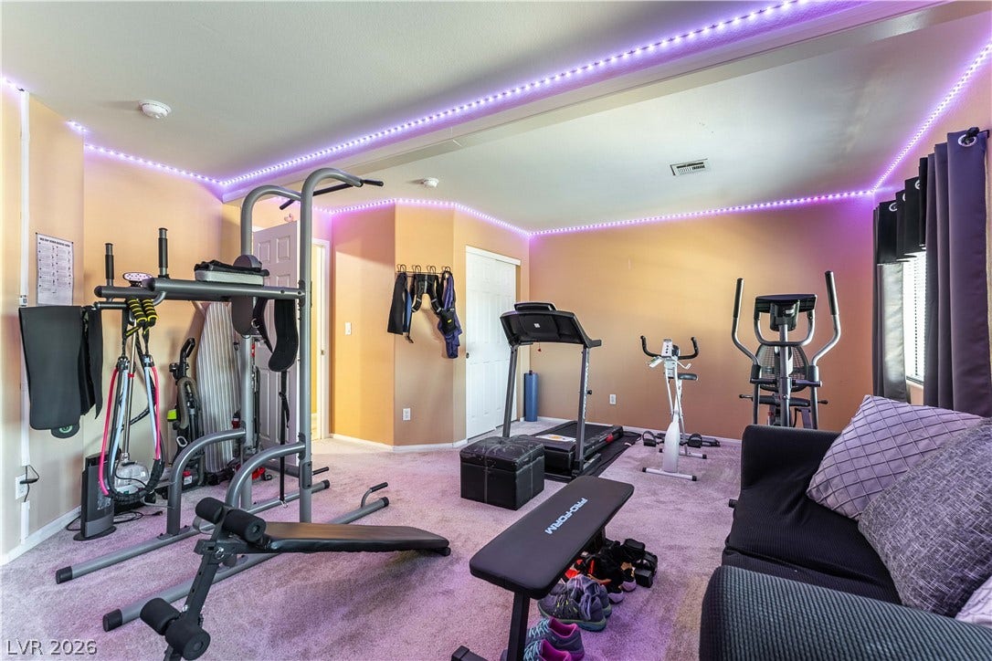 Smooth plaster walls and soft carpeting define this versatile bonus room space.