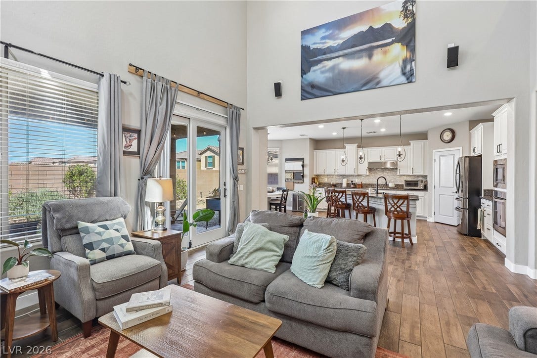 9490 Wild Valley Avenue, Las Vegas, NV 89148 High ceilings and an open floorplan seamlessly connect the living area to the kitchen.