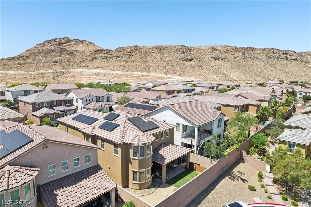 9490 Wild Valley Avenue, Las Vegas, NV 89148 Tile roofs and solar panels highlight these modern homes set against a dramatic mountain backdrop.
