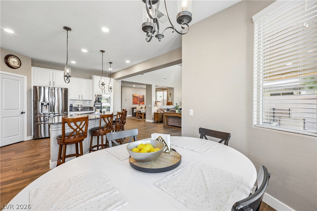 9490 Wild Valley Avenue, Las Vegas, NV 89148 An open dining area flows seamlessly into the kitchen and main living spaces beyond.