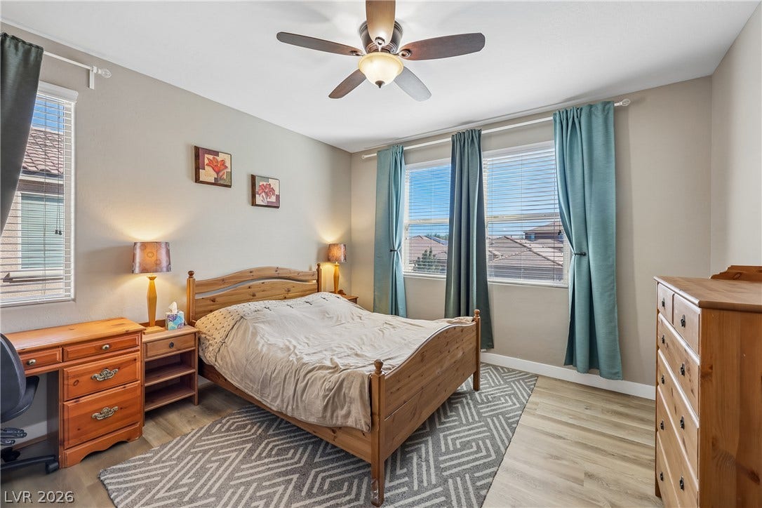 9490 Wild Valley Avenue, Las Vegas, NV 89148 Smooth wood-look flooring and multiple windows highlight this inviting and well-lit private retreat.
