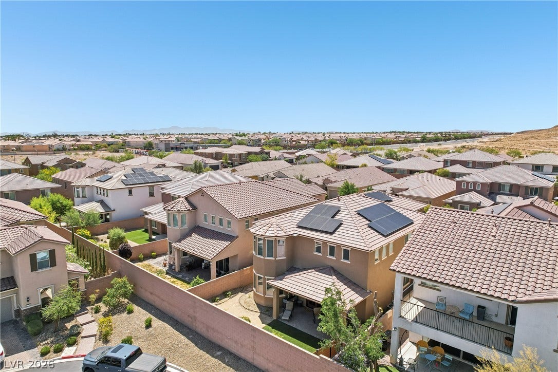 9490 Wild Valley Avenue, Las Vegas, NV 89148 Expansive desert views stretch across the surrounding neighborhood from this elevated vantage point.