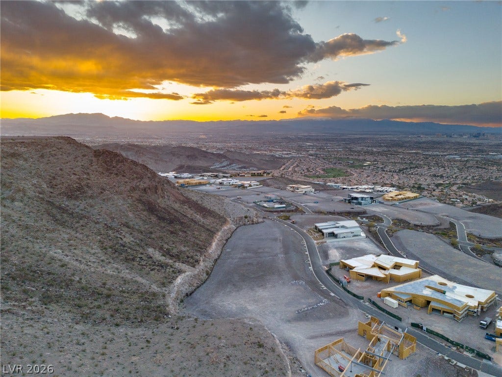 7 Chisel Crest Court, Henderson, NV 89012 Dramatic mountain and valley views unfold from this elevated hillside homesite at sunset.