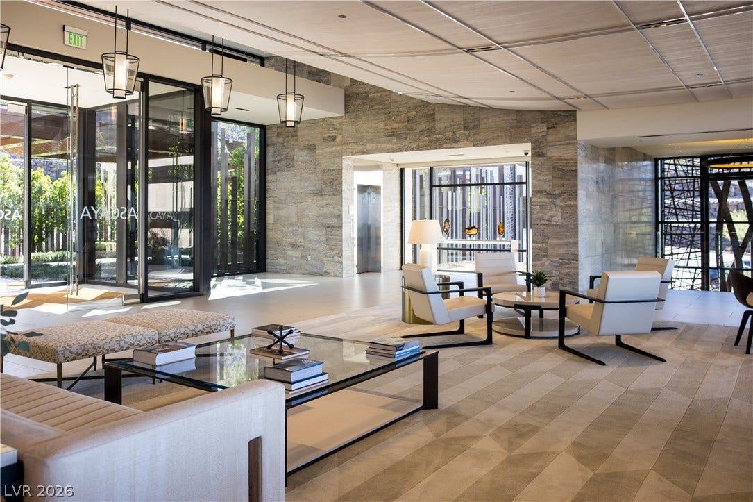 7 Chisel Crest Court, Henderson, NV 89012 A spacious stone accent wall anchors the open lobby with expansive glass entry doors.