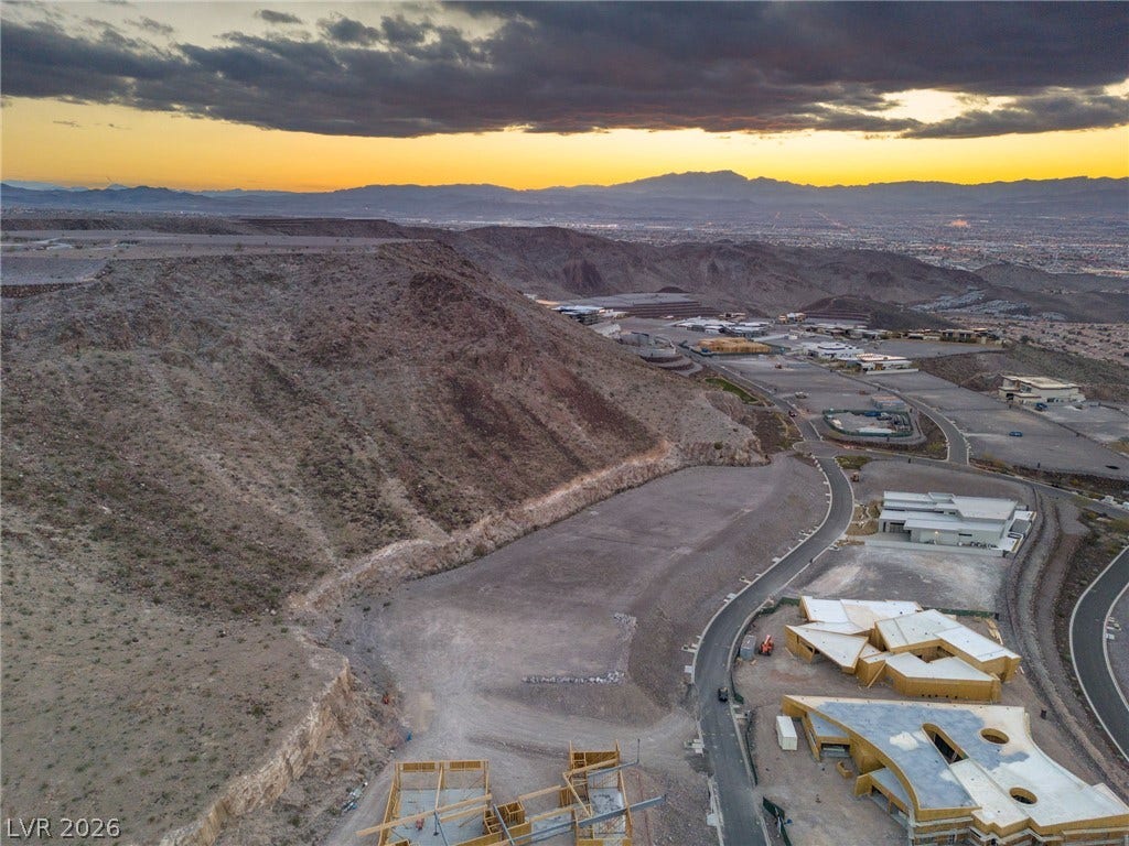 7 Chisel Crest Court, Henderson, NV 89012 Dramatic mountain vistas frame this high-elevation development site under a sunset sky.