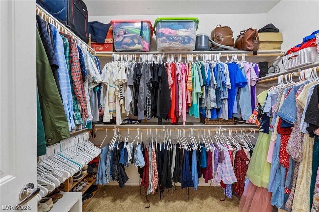 Organized closet with ample shelving and hanging space for all your storage needs.