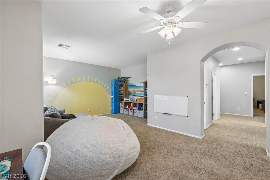 A well-lit bonus room offers versatile space for leisure or play.