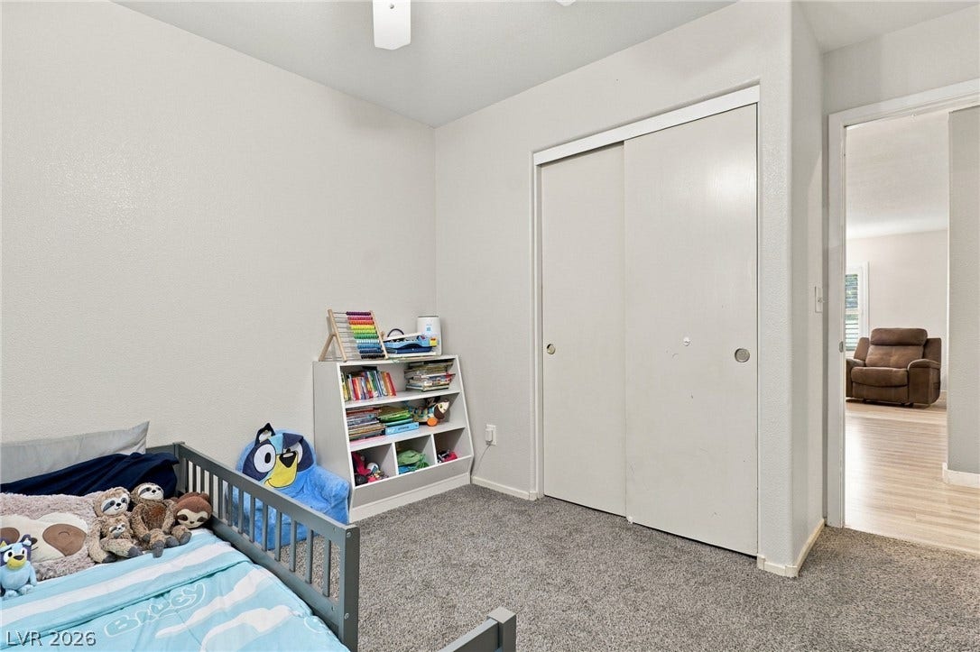 Plush carpeting anchors this comfortable bedroom complete with a spacious closet.