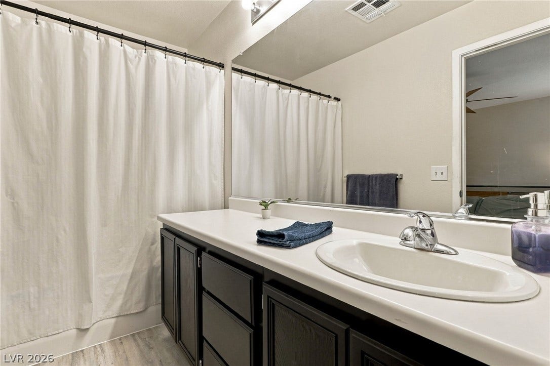 Modern cabinetry and clean countertops define this functional bath space.