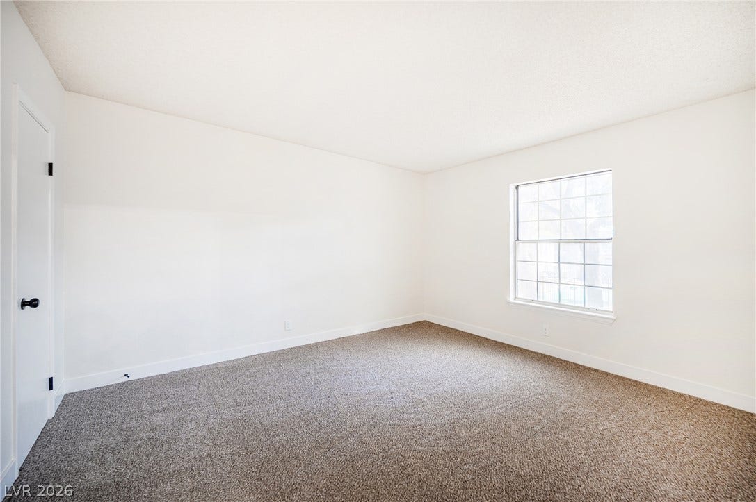 3823 S Maryland Parkway, #B11, Las Vegas, NV 89119 Plush carpeting anchors this versatile room under a smooth ceiling with natural window light.