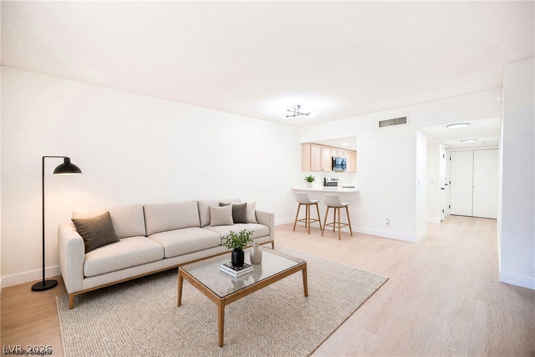 3823 S Maryland Parkway, #B11, Las Vegas, NV 89119 Clean lines and smooth wood floors define this open main living space.