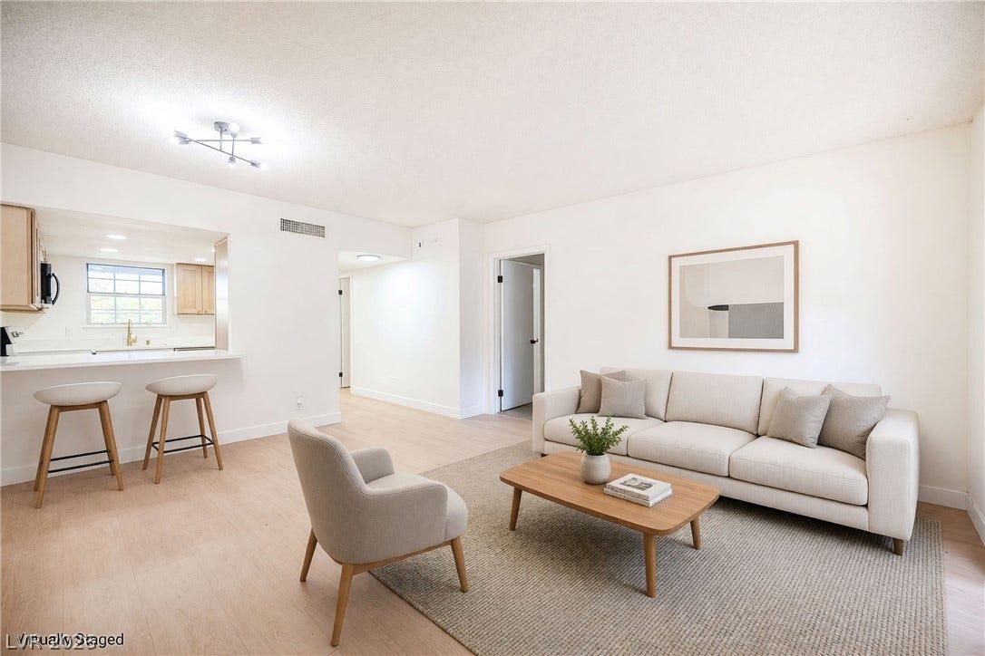 3823 S Maryland Parkway, #B11, Las Vegas, NV 89119 Smooth wood floors flow through this welcoming main level with an adjacent breakfast bar.
