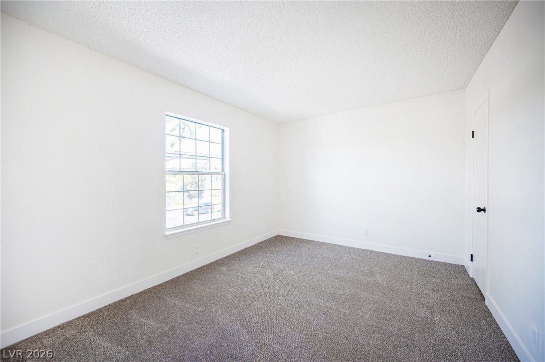 3823 S Maryland Parkway, #B11, Las Vegas, NV 89119 Plentiful natural light fills a versatile bedroom featuring soft carpeting and clean white walls.