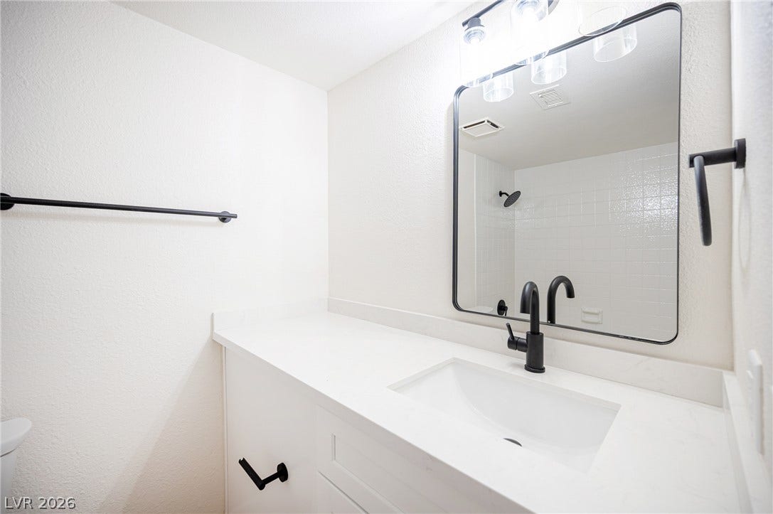 3823 S Maryland Parkway, #B11, Las Vegas, NV 89119 Clean lines and matte black fixtures define this updated, modern vanity space.
