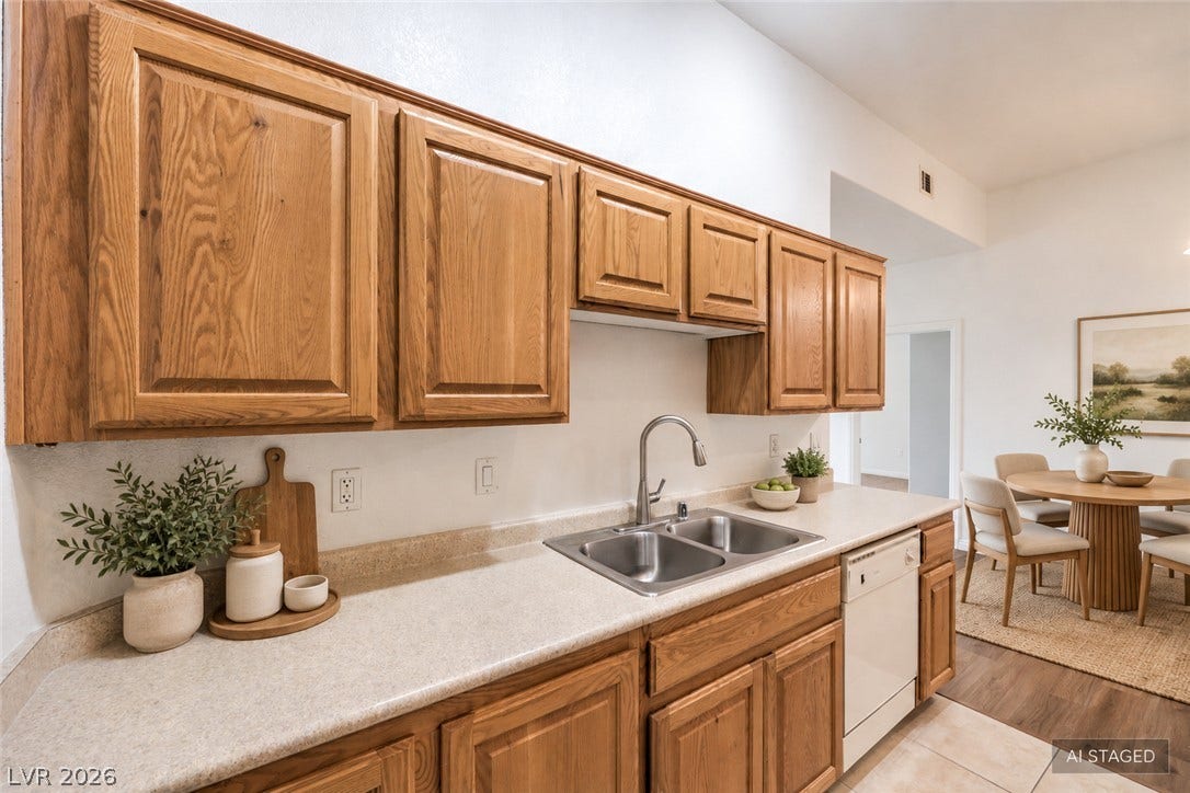 Rich wood cabinetry paired with laminate countertops defines this efficient cooking space.