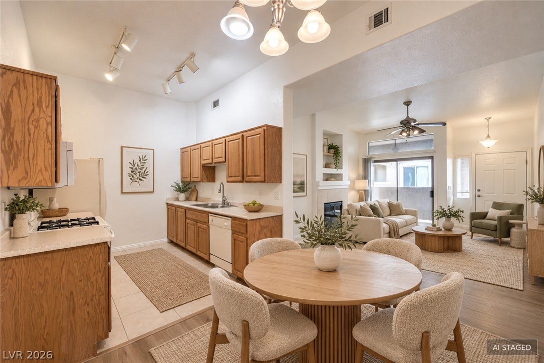Soaring ceilings and warm wood cabinetry define this inviting culinary and dining space.