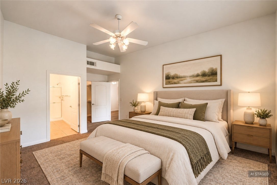 A spacious primary bedroom features soft carpeting, high ceilings, and an adjoining private bath.